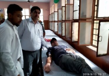 Jan Sewa Trust-NGO medical team attending to a patient in a clinic room