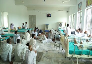 Jan Sewa Trust NGO: Patients resting in a clean, well-lit ward.