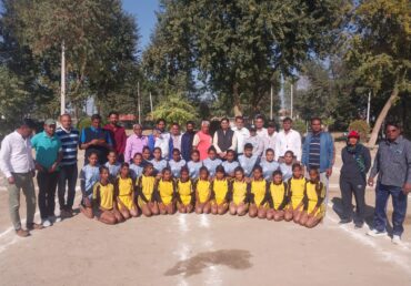 Group photo of Jan Sewa Trust NGO members with a school sports team